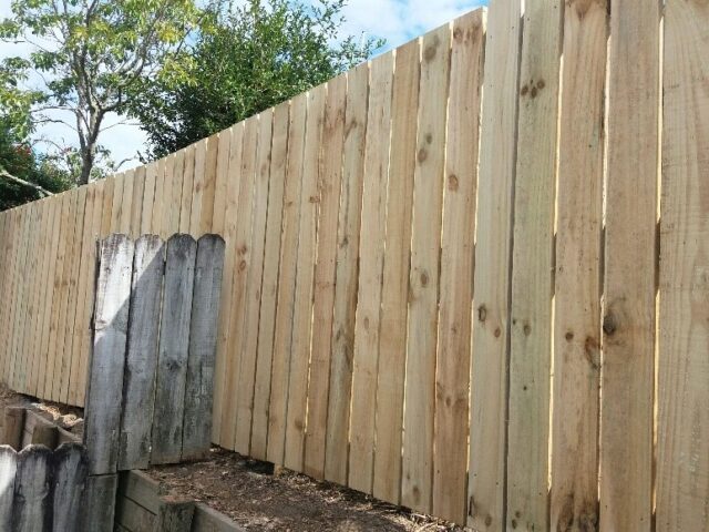 Timber fencing on retaining walls